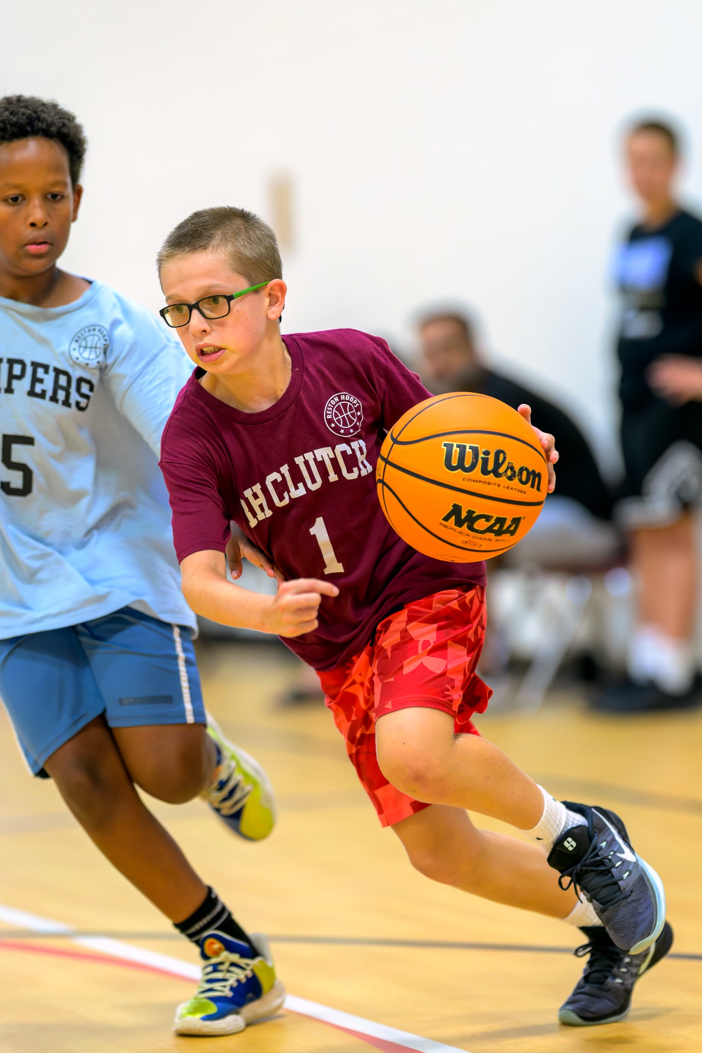 Youth basketball player drives to the basket
